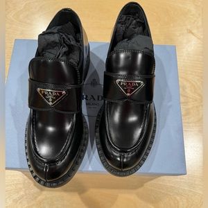 Prada
Leather Triangle Logo Loafers